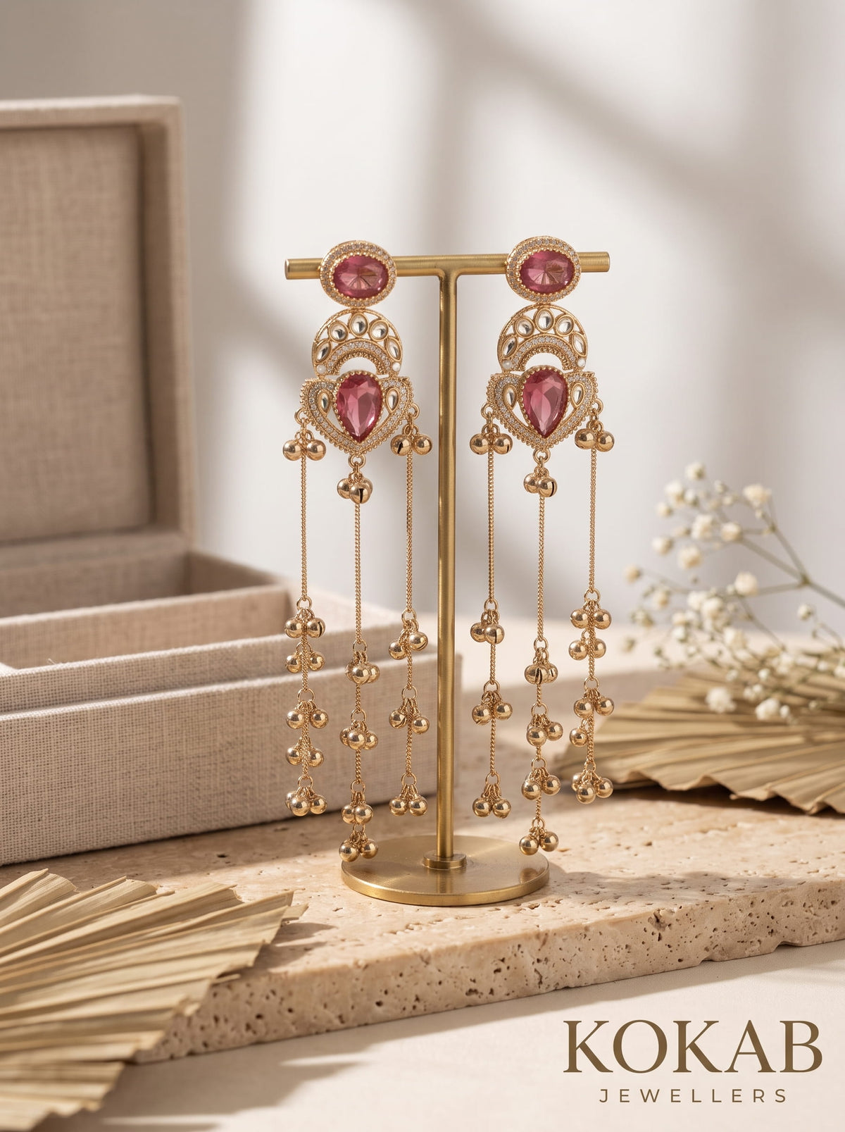 Deep red Kashmiri long dangle earrings featuring Kundan work and cascading ghungroo tassels.