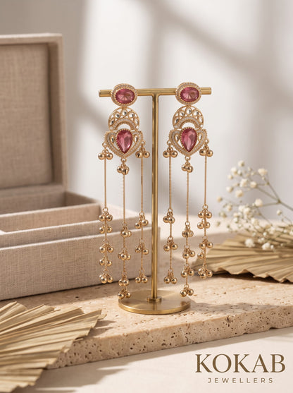 Deep red Kashmiri long dangle earrings featuring Kundan work and cascading ghungroo tassels.