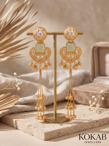White Kashmiri long dangles with heart and floral gold-finished filigree and cascading ghungroo bells.