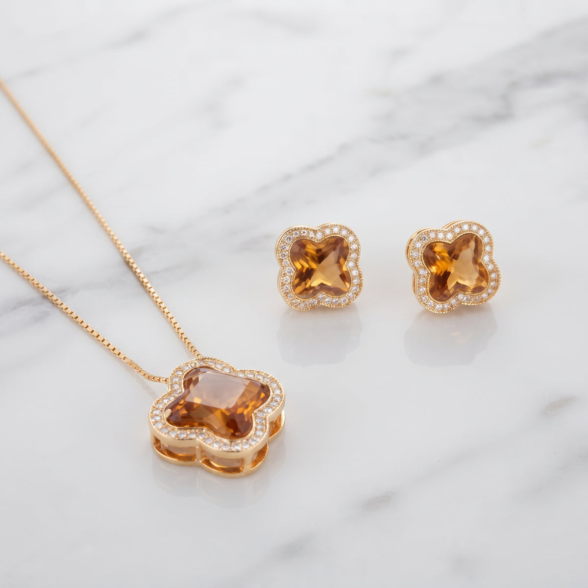 Close-up of Amber Gold Clover Pendant Necklace and Earrings with Diamond Accents - Kokab Jewellers