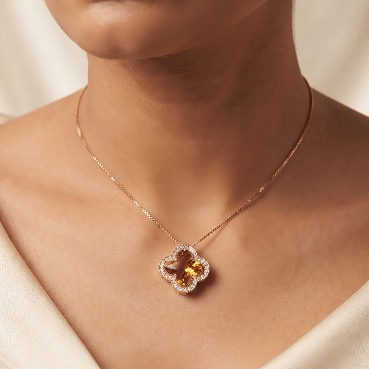 Close-up of Amber Gold Clover Pendant Necklace with Diamond Accents - Kokab Jewellers