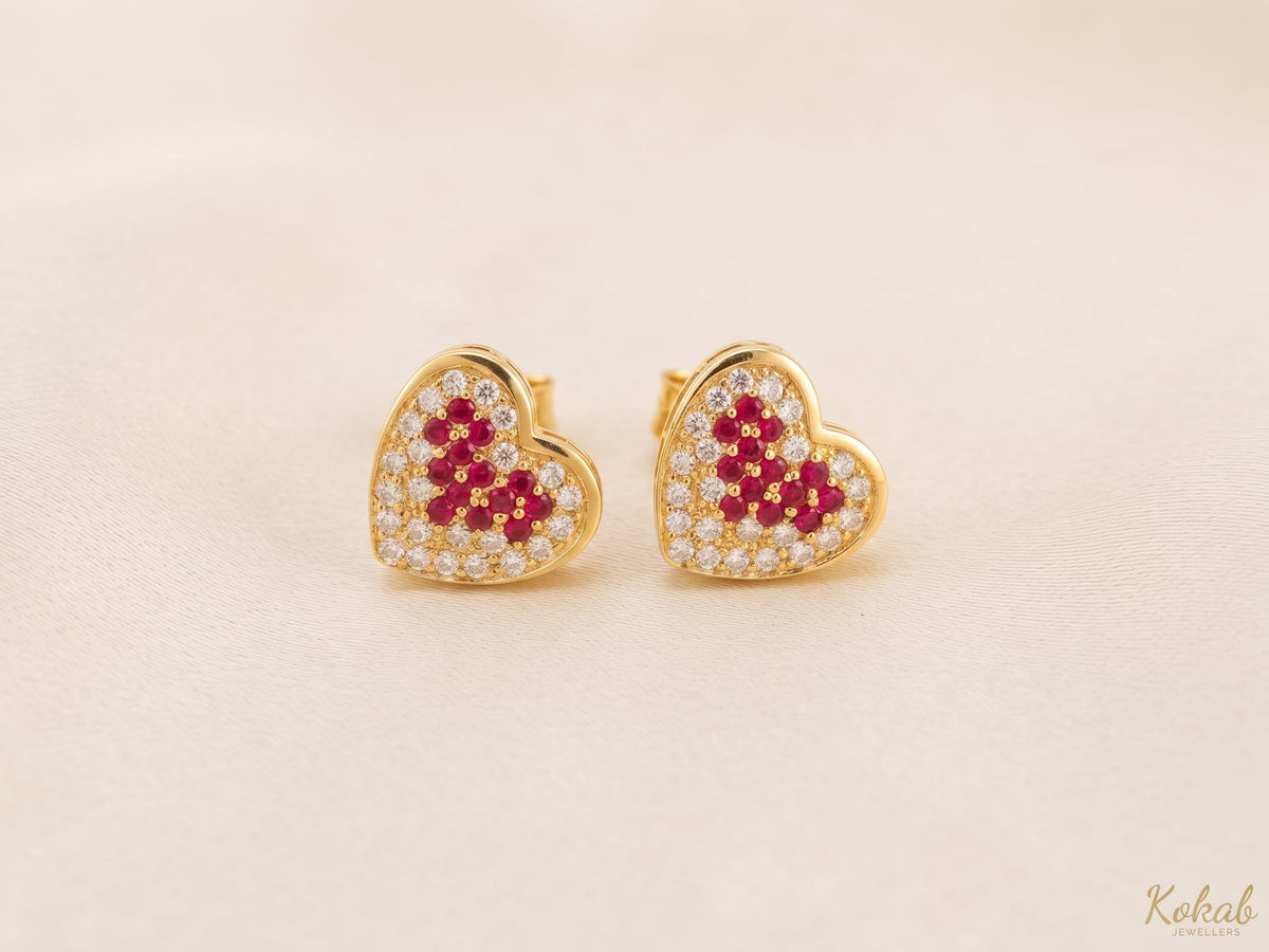 Two-tone gold plated heart jewellery set featuring red crystals