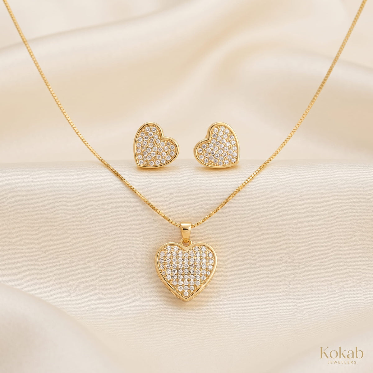 Solid gold plated heart jewellery set featuring clear gold crystals