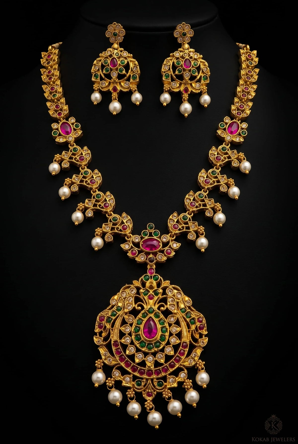 Peacock ruby long necklace set with pearl drops on black background