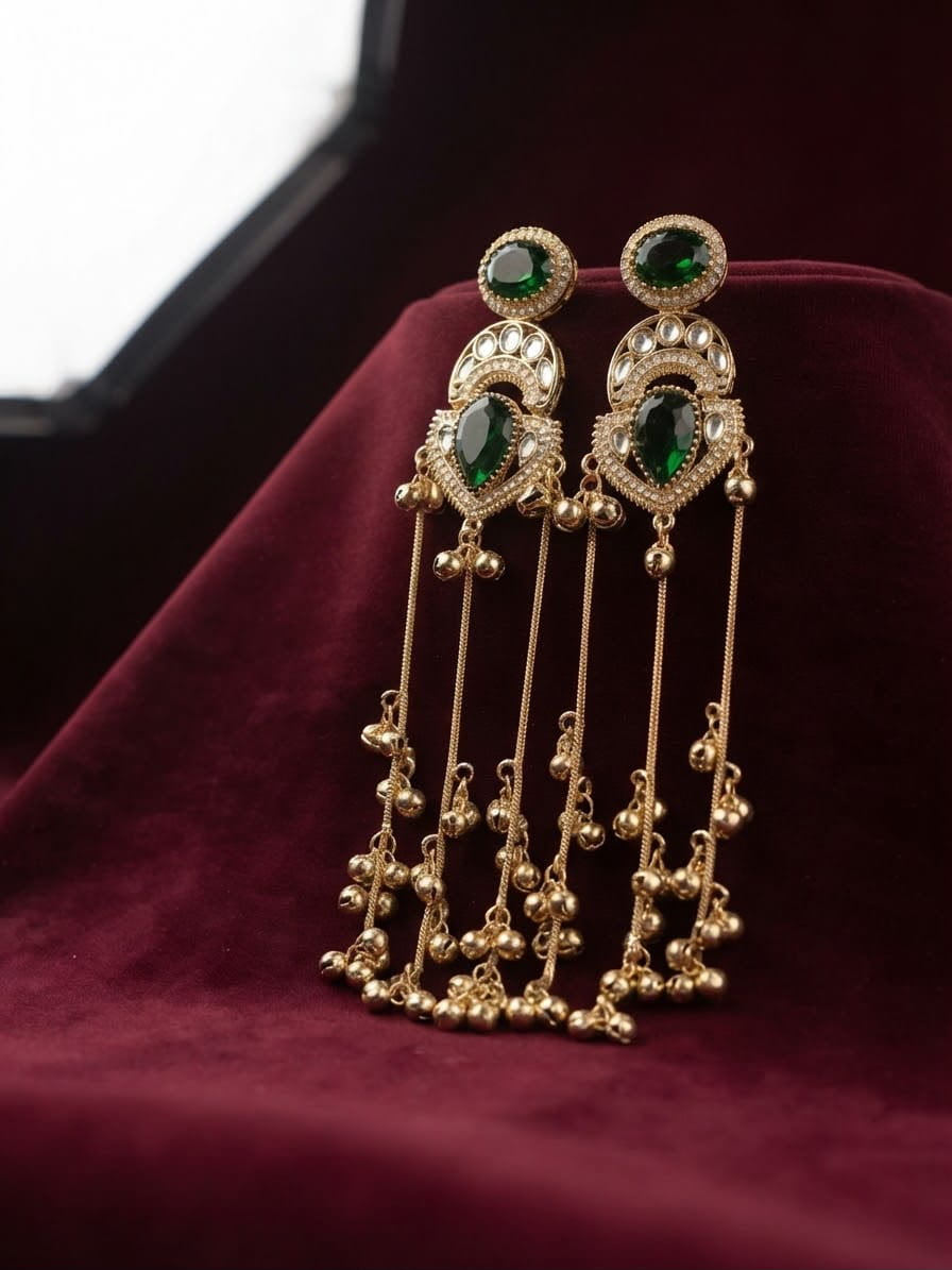 Emerald green Kashmiri long dangle earrings featuring Kundan work and cascading ghungroo tassels.