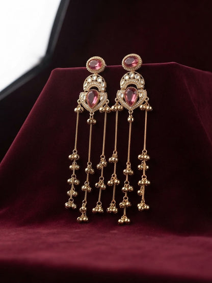 Deep red Kashmiri long dangle earrings featuring Kundan work and cascading ghungroo tassels.