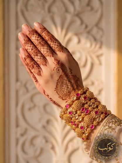 Gold plated ruby medallion bangles on henna hand - wide kangan set Pakistan