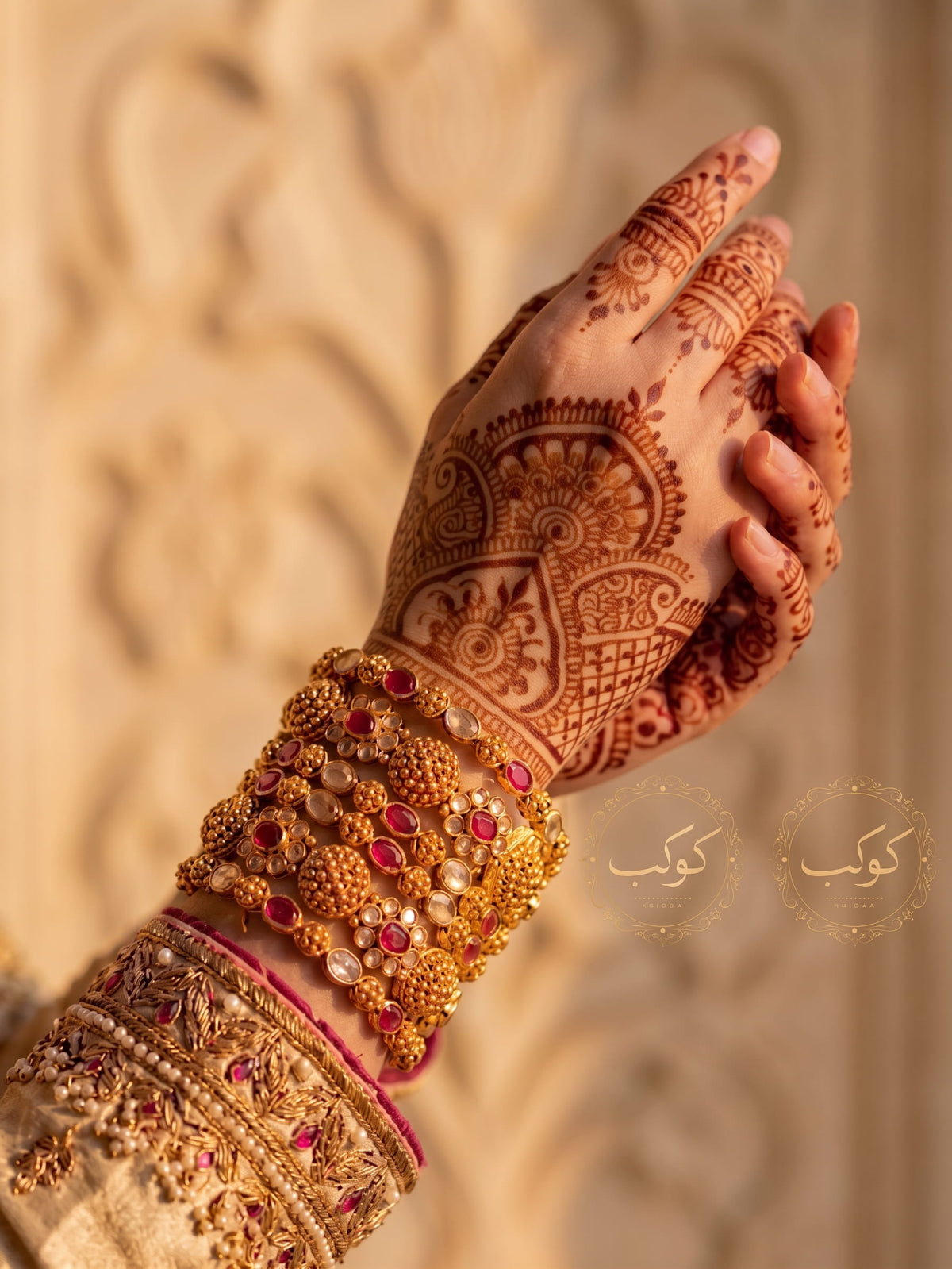 Ruby medallion gold bangles worn on henna wrist - bridal kangan set Pakistan