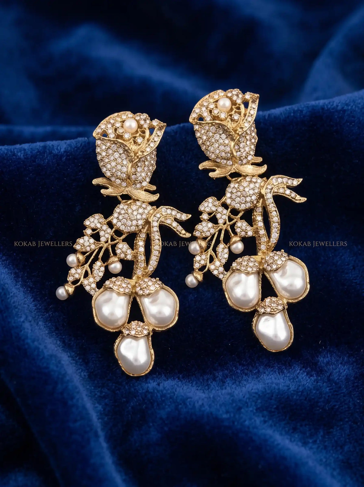 Crystal white stone rose earrings with baroque pearl cluster and antique gold finish
